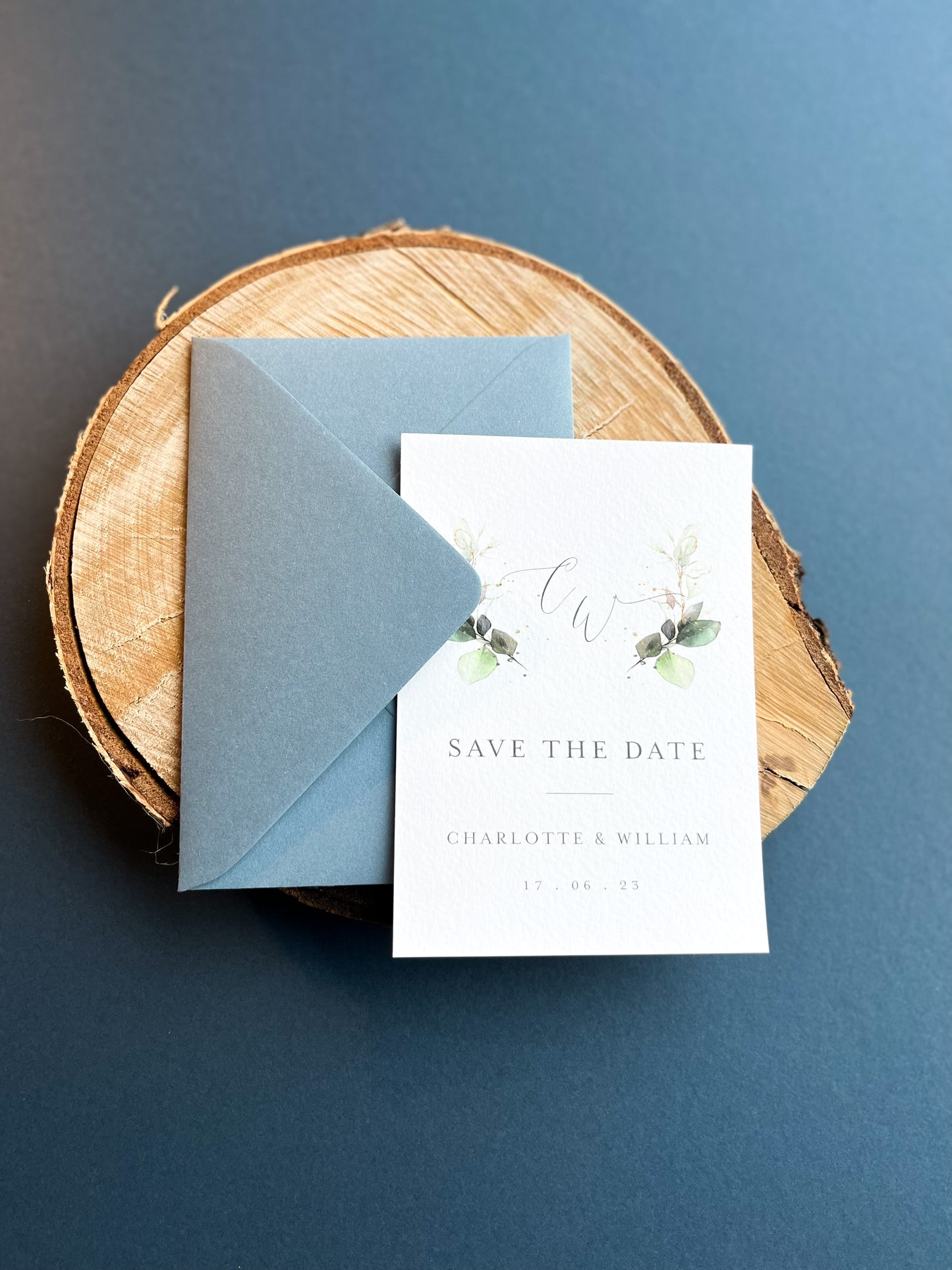 Greenery design save the date with dusty blue envelopes