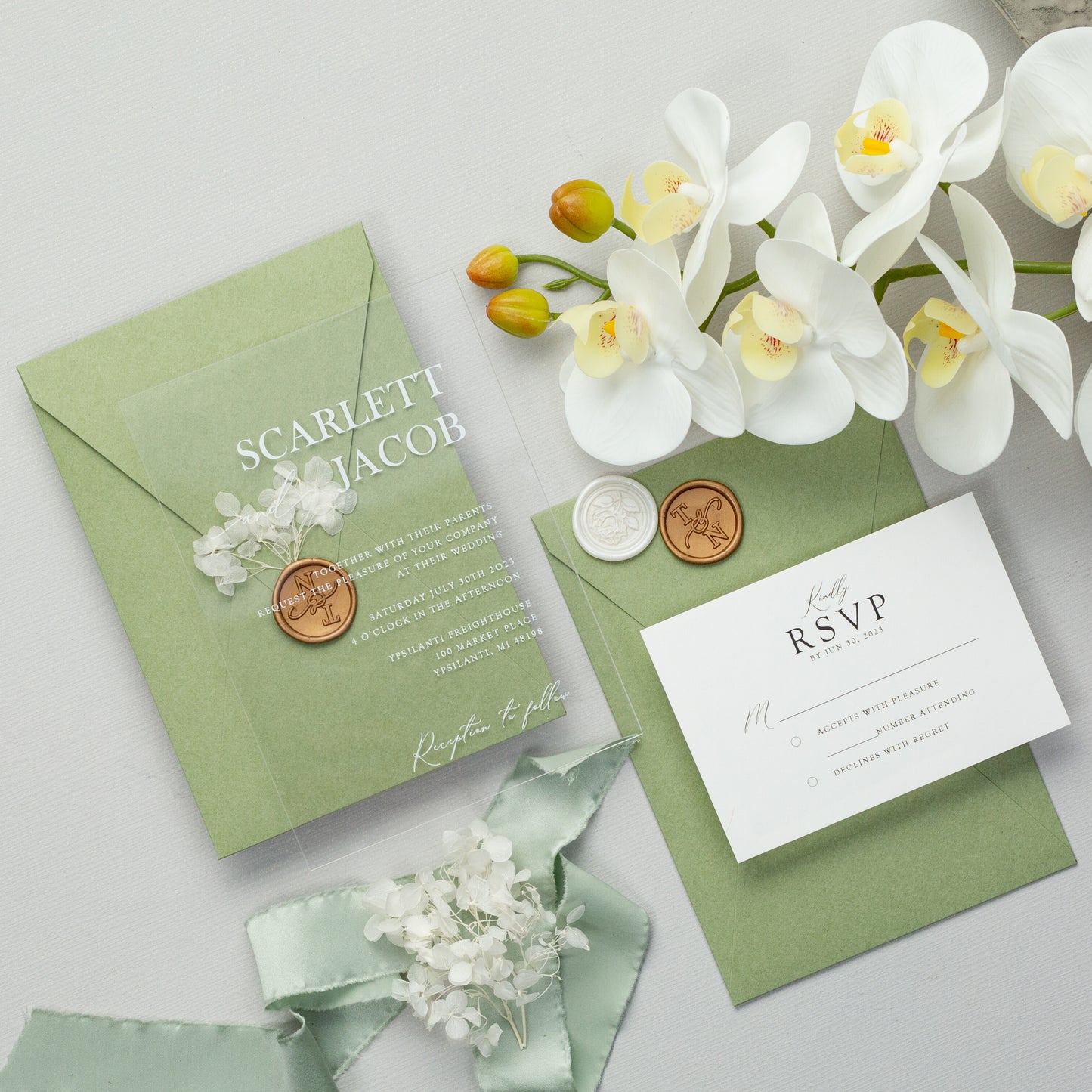 Simple acrylic wedding invitations with sage green envelopes