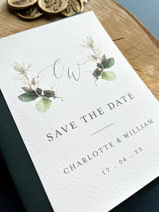 Hunter green save the date with beautiful greenery monogram design