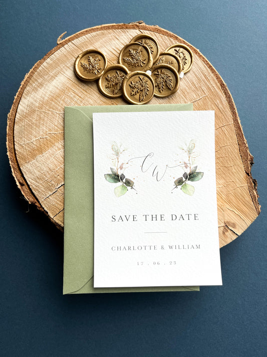 Sage green save the date with monogram greenery design